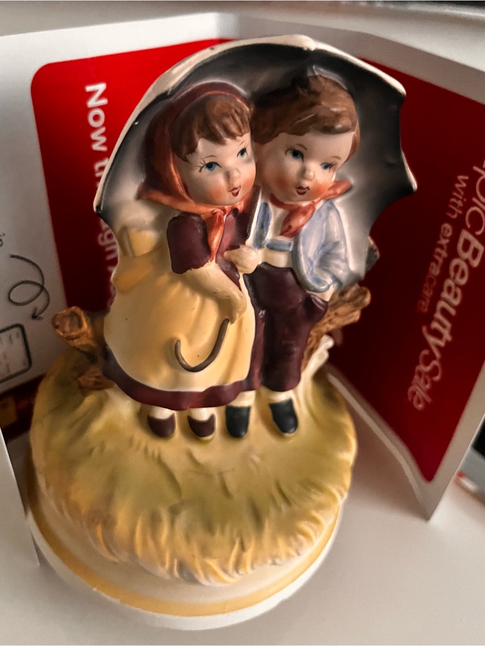 Hand-Painted Yellow and Brown Ceramic Couple Figurine with Umbrella